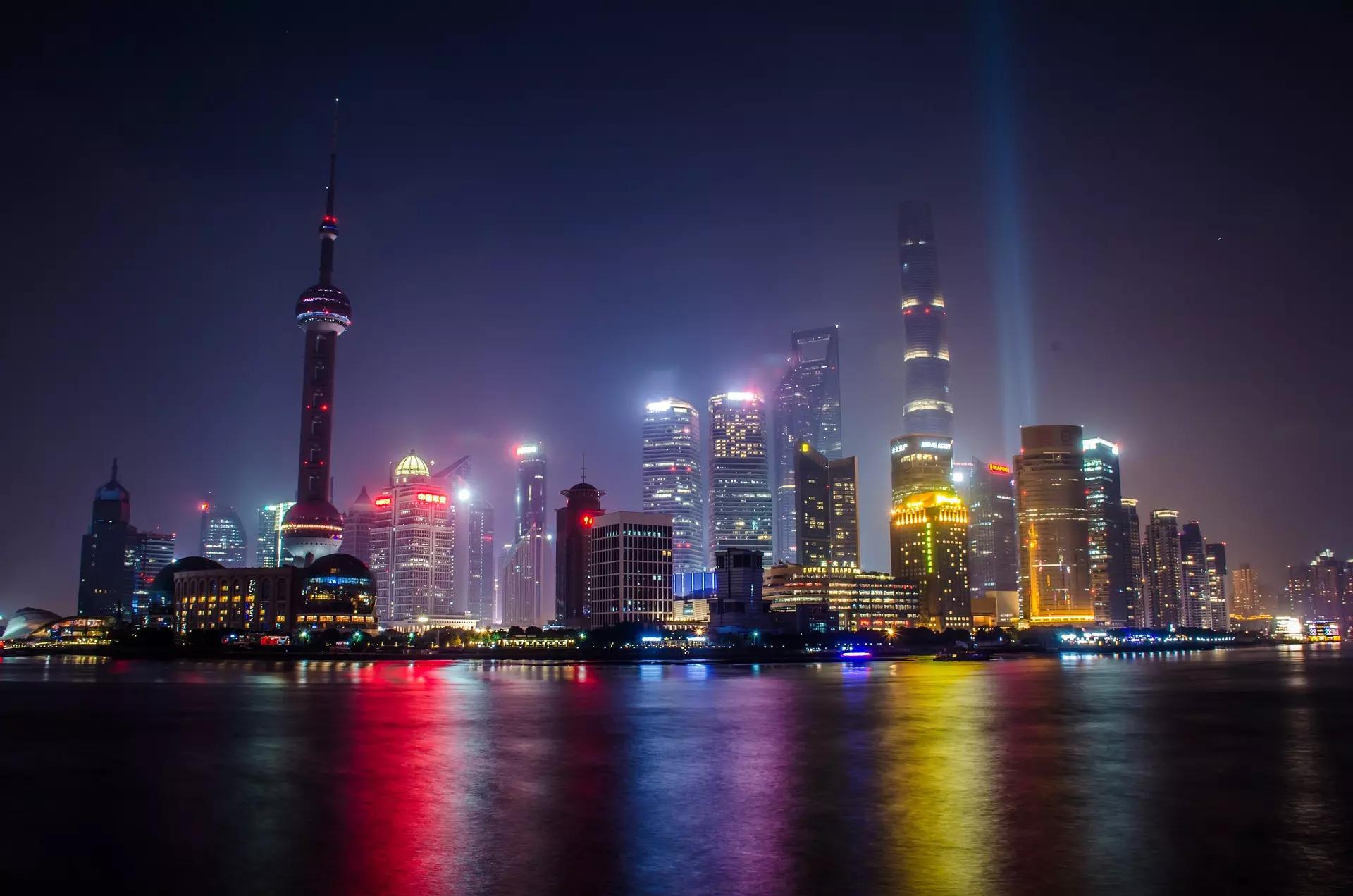 The Bund and Pudong skyline illuminated beside the Huangpu River in Shanghai